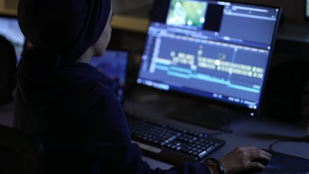 woman editing video in premiere pro